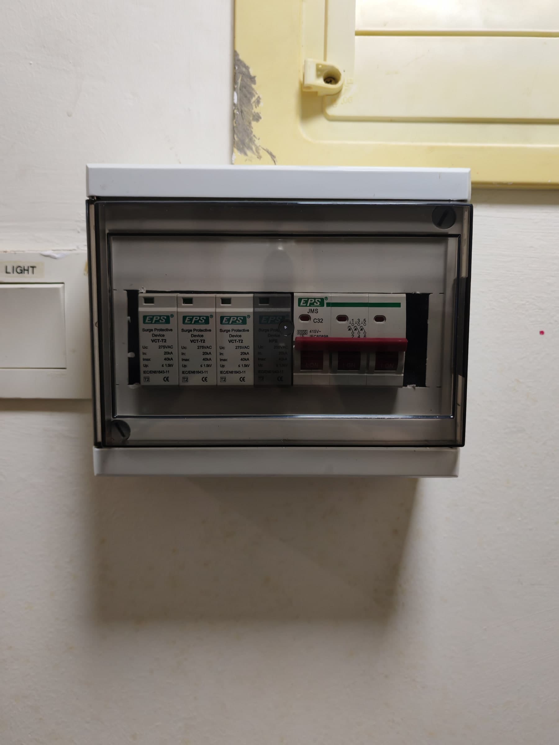 Completed FastFix SPD installation in a distribution board with its protective cover fitted.